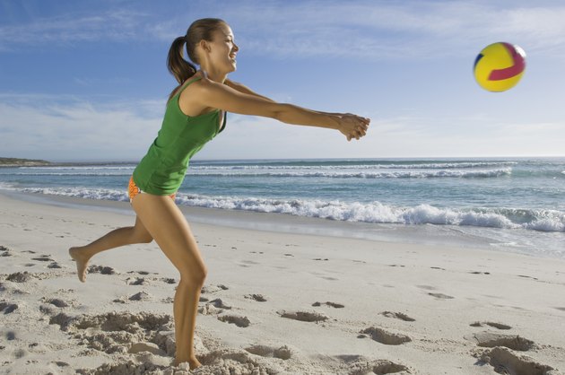 Woman playing beach volleyball