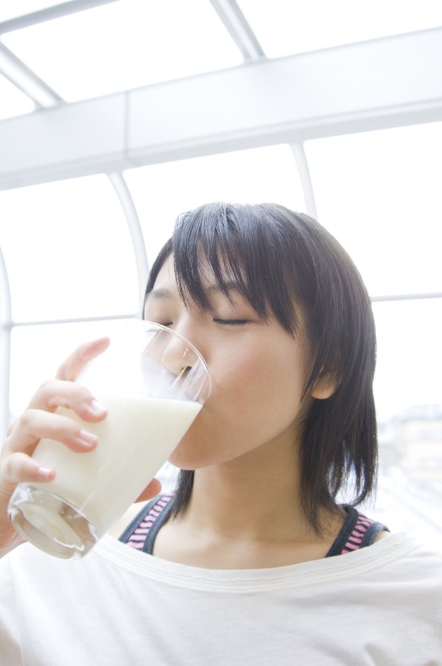 Young Woman Drinking Milk