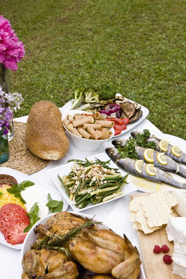 Food at outdoor dinner party in countryside