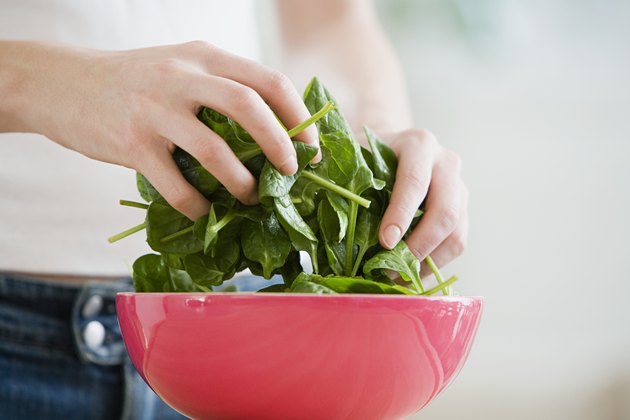 Person preparing spinach