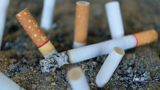 Cigarette burning in ashtray