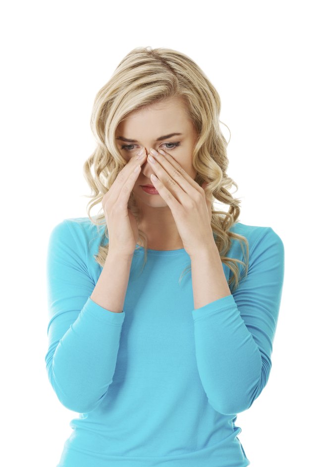 Woman with sinus pressure pain