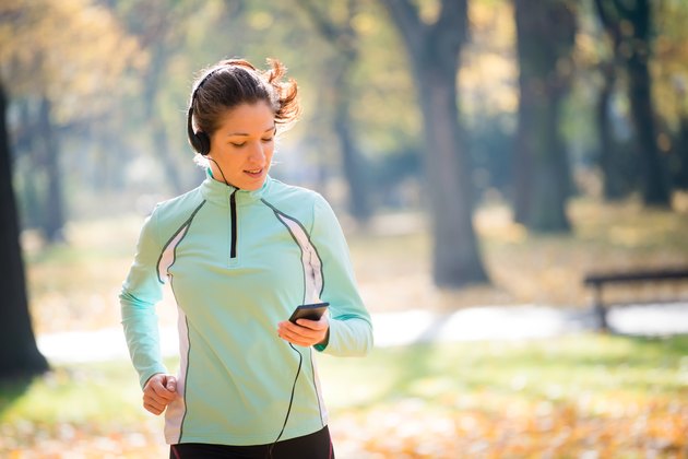 Woman jogging and listening music