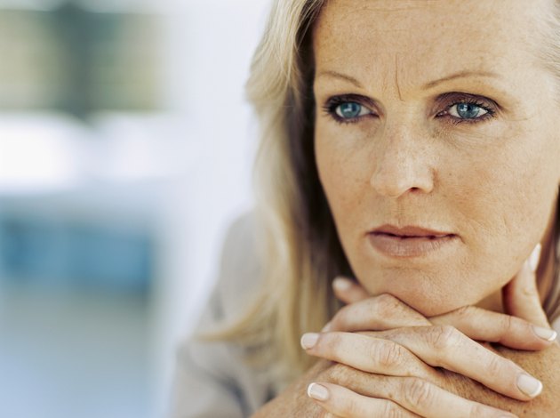 close-up of a businesswoman with her hands clasped
