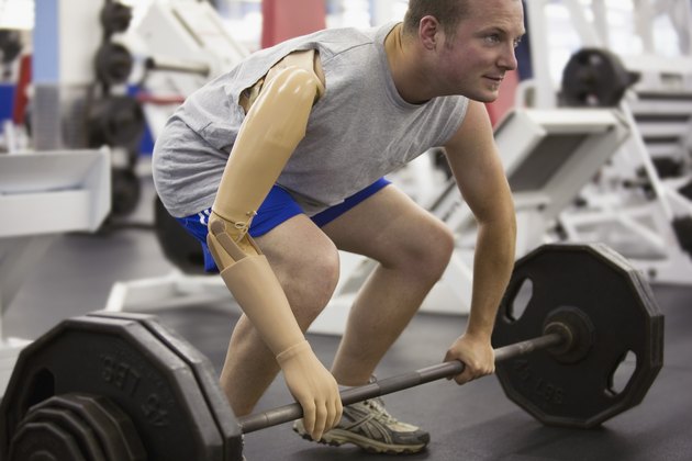 Man with prosthetic arm lifting weights