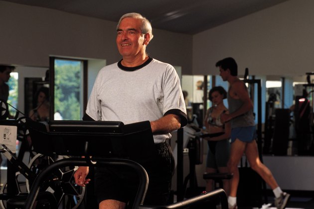 Man exercising on treadmill at gym