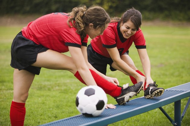 Soccer players stretching
