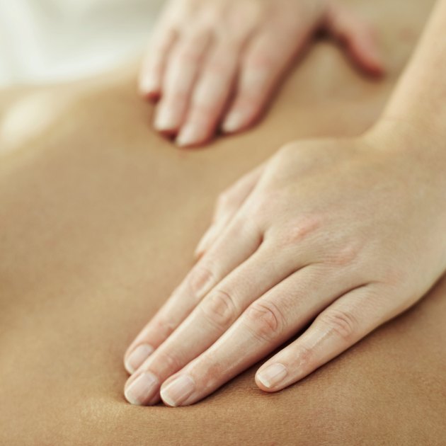 close-up of a person getting a back massage