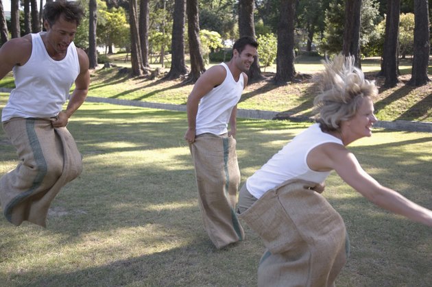 People hopping in sack race