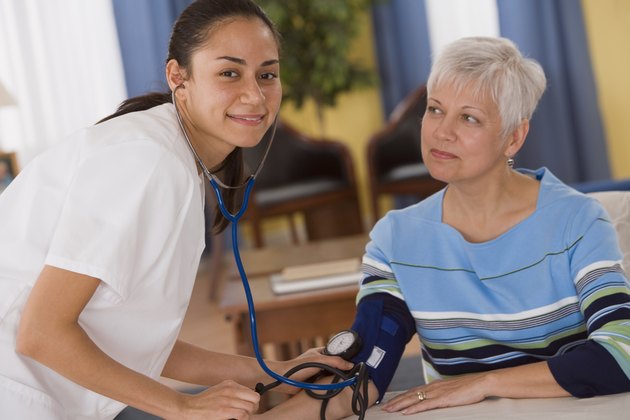 Woman getting her blood pressure taken