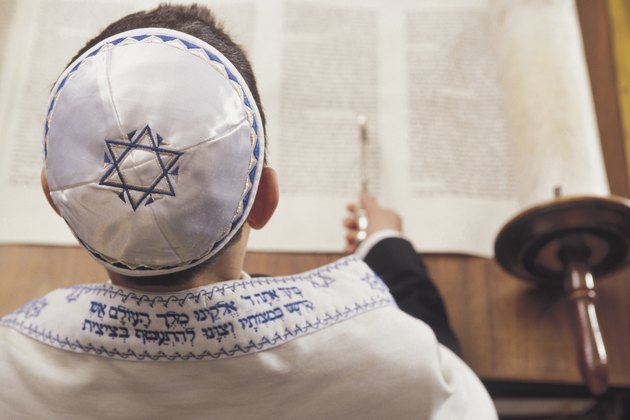 Boy reading the torah at his Bar Mitzvah