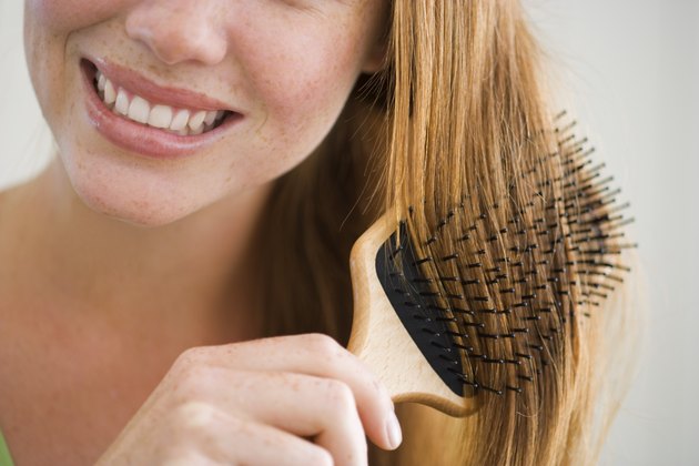 Woman combing her hair