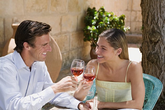 Couple toasting with red wine