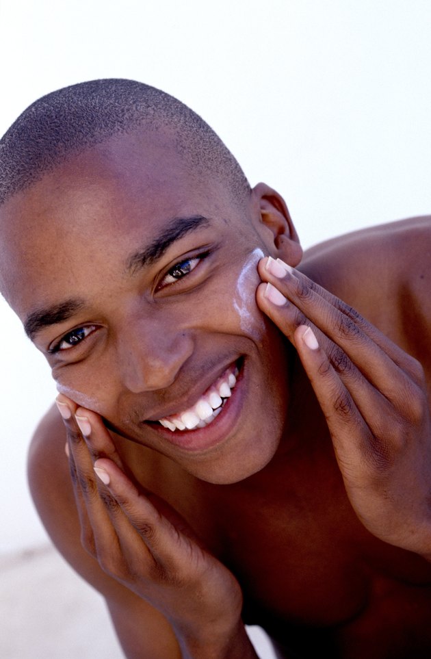 Man applying face cream