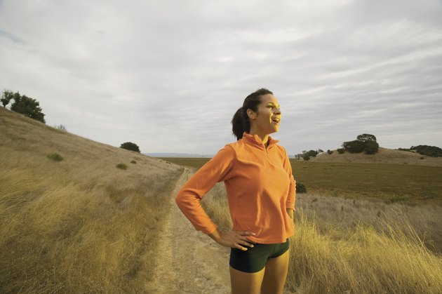 Portrait of woman jogging in country