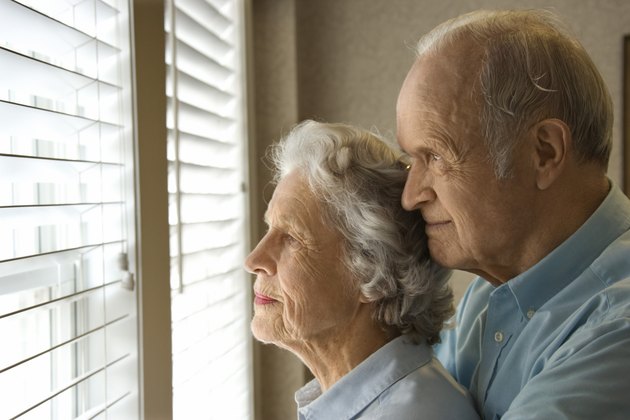 Couple waiting by window