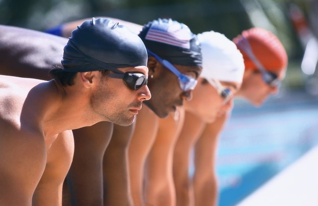 view of male swimmers at the start of a race