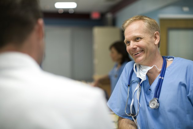 Doctors talking in hospital reception area