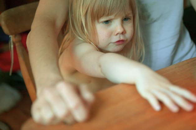Frustrated girl sitting at table
