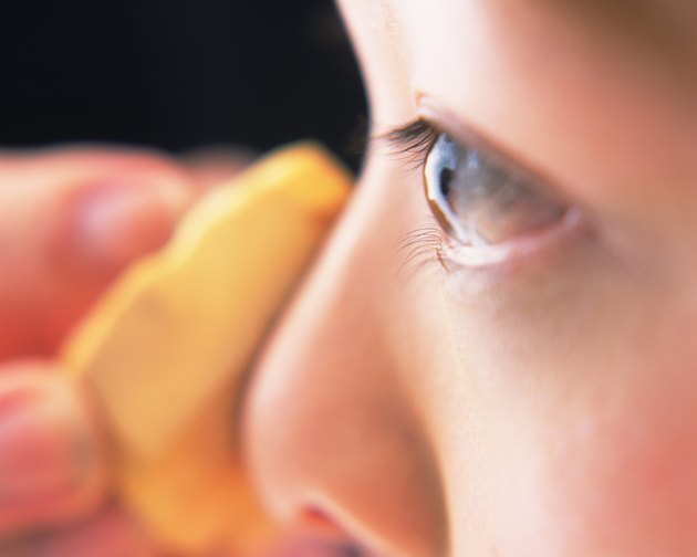 Closed Up Image of a Woman Applying Some Foundation, Differential Focus