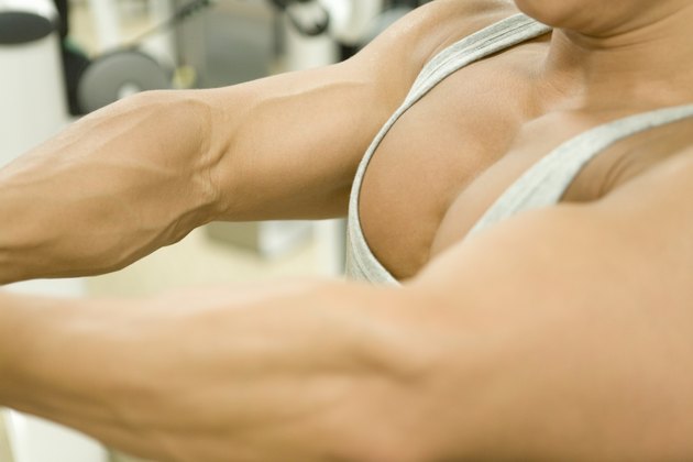 Man doing exercise in gym, high angle view, close up, differential focus