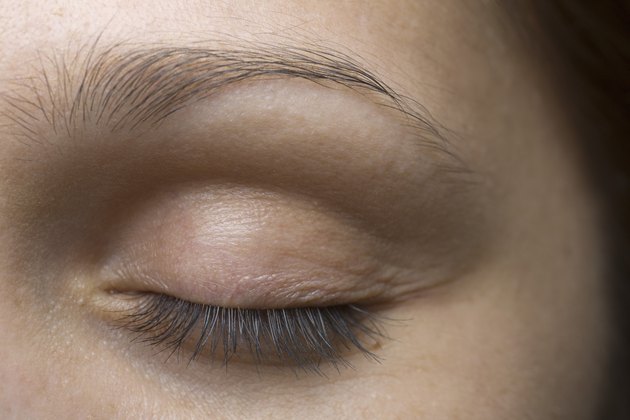 Close-up of young woman's closed eye