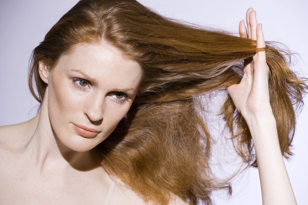Woman with touching her hair