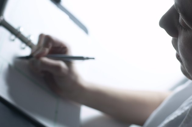 Woman writing in datebook