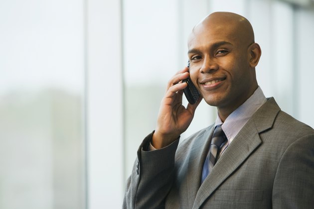 African businessman talking on cell phone