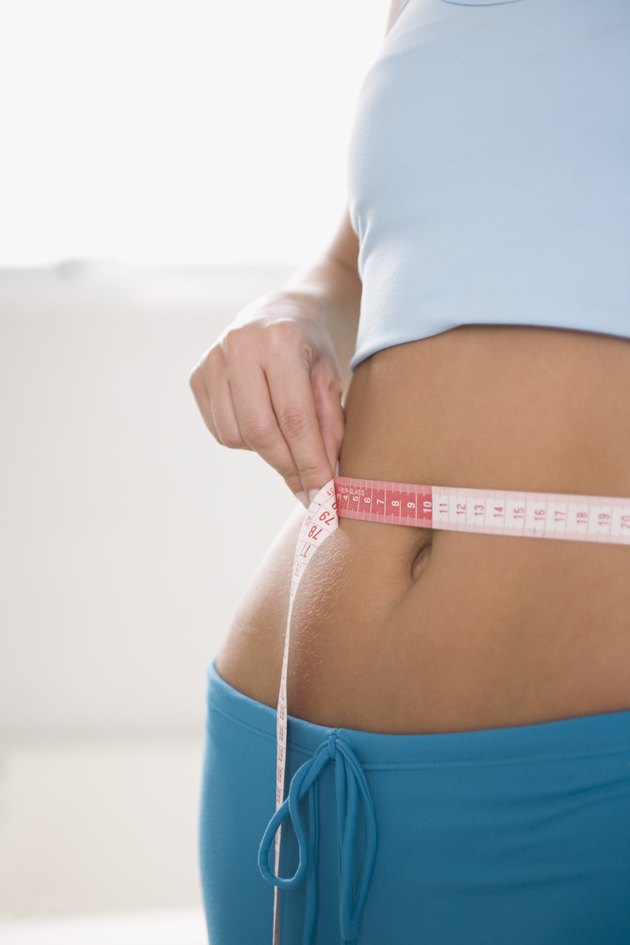 Woman measuring waist