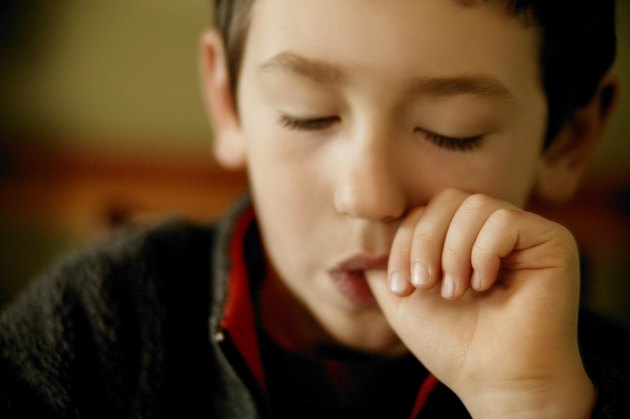 Young boy fallen asleep while sucking thumb
