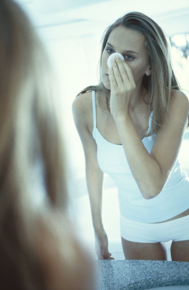 Woman removing makeup