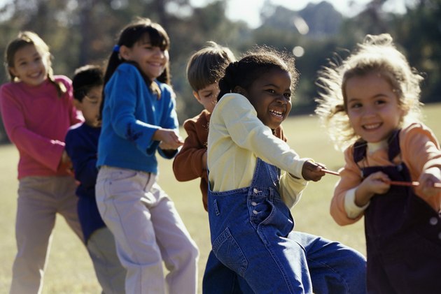 Group of children playing tug-of-war