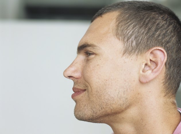 Young man smiling,profile,close-up