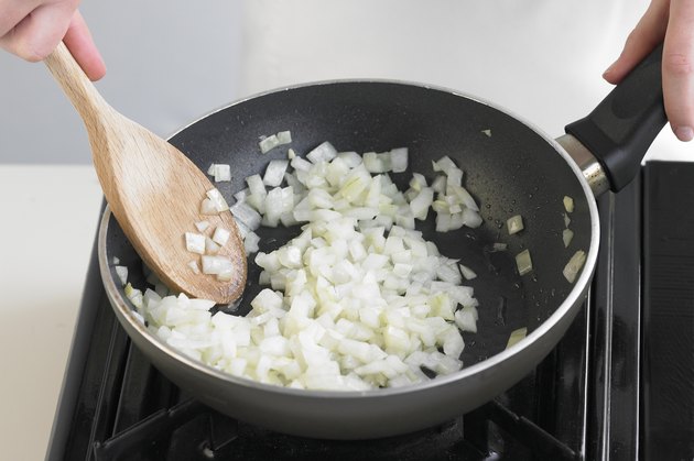 Frying onions, close up