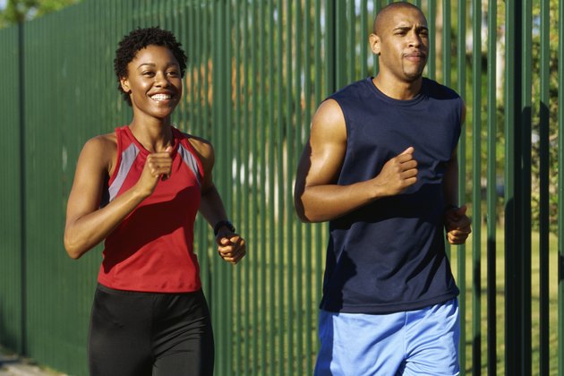 Close-up of two young people jogging
