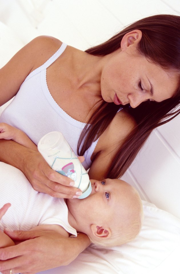 Mother feeding hungry baby