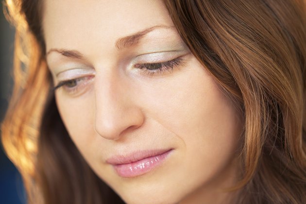 Close-up head shot of depressed woman