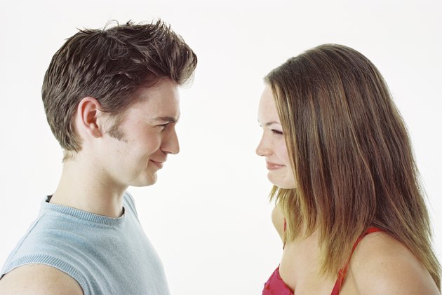 Teen couple facing each other