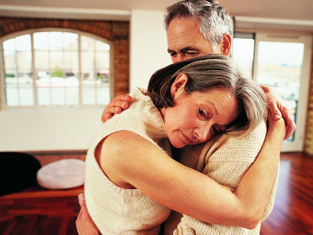 Mature Couple Embracing in Their Apartment