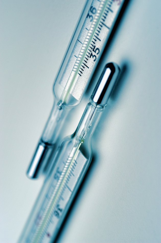 Two glass thermometers, close-up