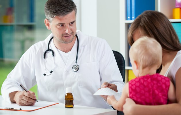Pediatrician giving prescription