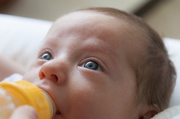 Newborn baby drinking milk