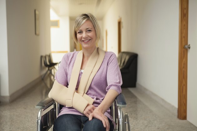 Patient in wheelchair with broken arm
