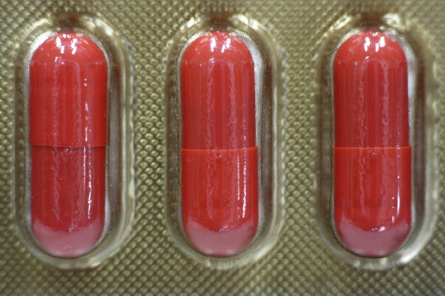 orange capsule in blister pack close up 3