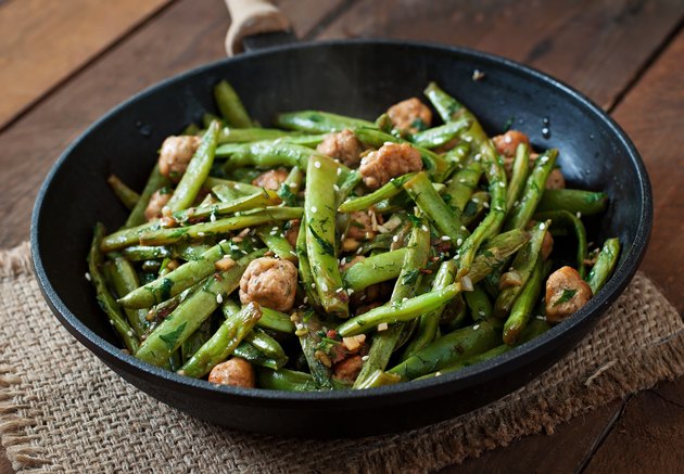 Green beans fried with chicken meatballs and garlic Asian style