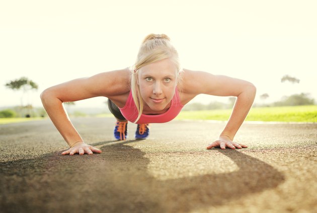 Attractive young woman doing push up