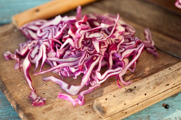 Close up of sliced red cabbage on grater