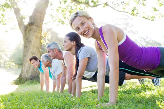 Happy athletic group training
