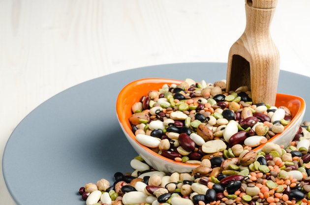 legumes in a dish on wood, close up, background